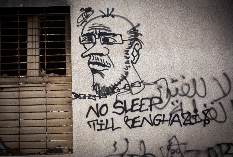 Graffiti on a wall mocks disposed leader Muammar Gaddafi on October 18, 2011 in Benghazi, Libya.
