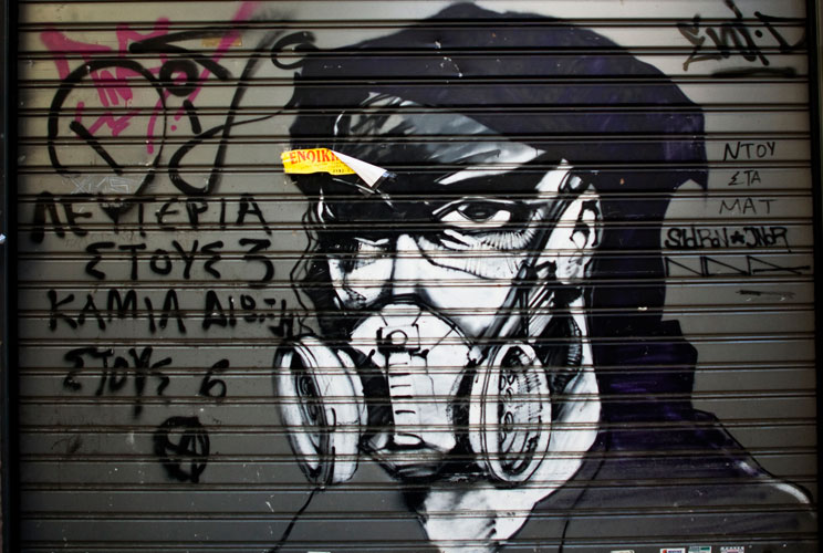 Graffiti is displayed on a building on December 6, 2011 in Athens, Greece. Graffiti artists throughout the city are expressing the effects of austerity measures that have plagued the community as Greece continues to struggle in debt while lawmakers today